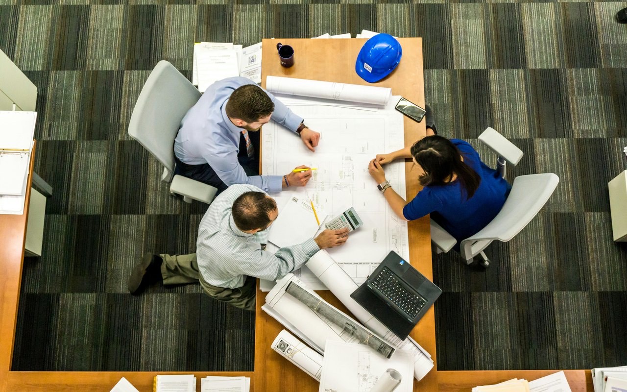 Advisers working together around a table