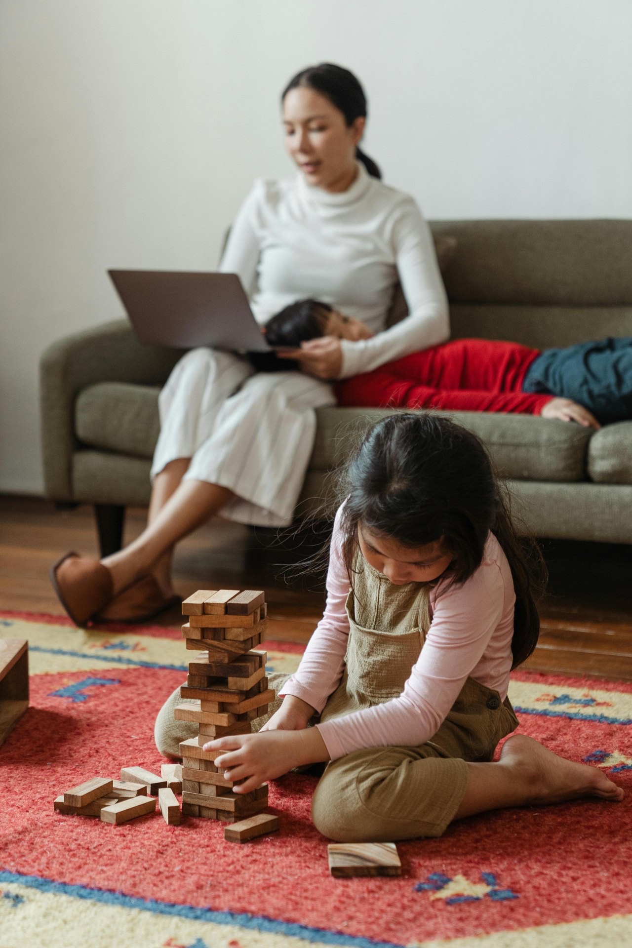 A family relaxing together on the living-room floor