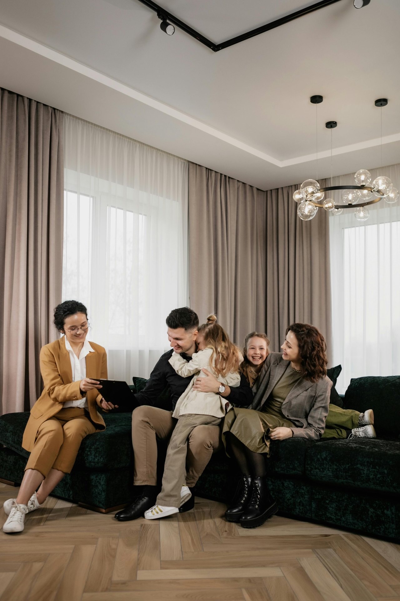 A relaxed multi-generation family together on a sofa