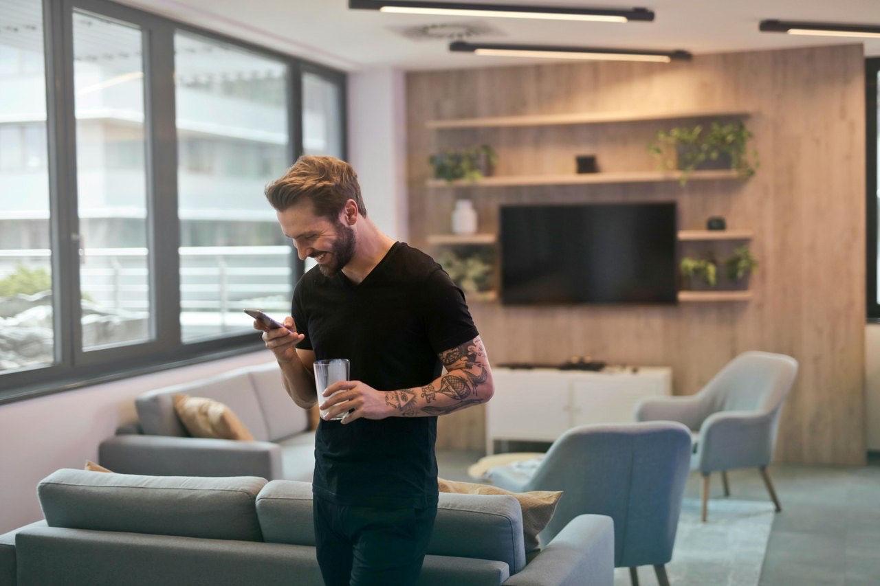 A man planning at home in a bright living room