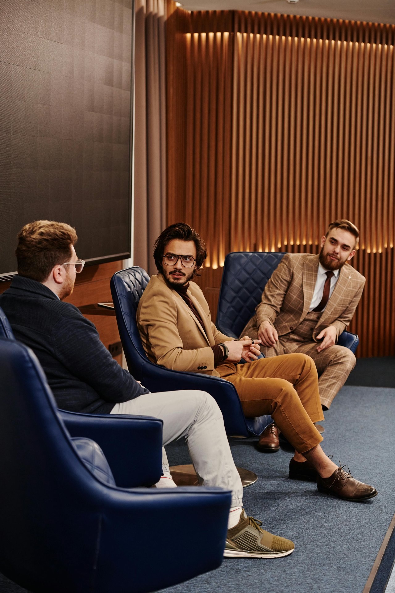 An adviser meeting clients in a comfortable lounge